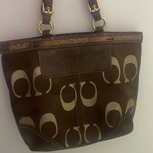 Tan and gold brown coach bag has plenty of space in bag to put things